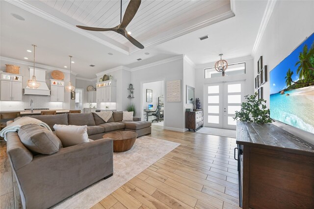 1801 Los Alamos Dr, Punta Gorda, FL 33950 - living room featuring light wood-type flooring, a ceiling fan, ornamental molding, french doors, and recessed lighting