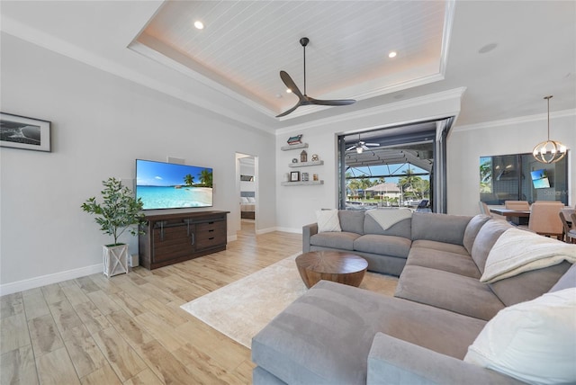 1801 Los Alamos Dr, Punta Gorda, FL 33950 - living room featuring a raised ceiling, light wood-style floors, ceiling fan, recessed lighting, and crown molding