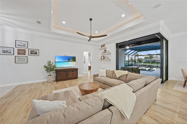 1801 Los Alamos Dr, Punta Gorda, FL 33950 - living room with ornamental molding, ceiling fan, a raised ceiling, light wood-style floors, and a sunroom