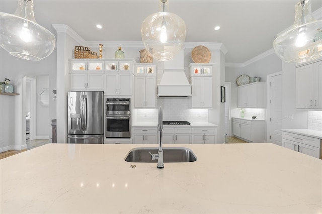 1801 Los Alamos Dr, Punta Gorda, FL 33950 - kitchen with stainless steel appliances, decorative backsplash, crown molding, light stone countertops, and recessed lighting