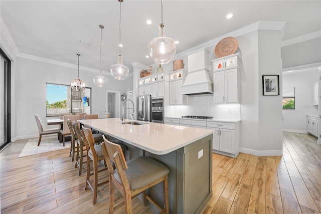 1801 Los Alamos Dr, Punta Gorda, FL 33950 - kitchen with stainless steel appliances, plenty of natural light, an island with sink, light countertops, and recessed lighting