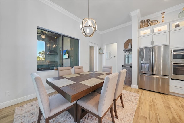 1801 Los Alamos Dr, Punta Gorda, FL 33950 - dining space with ornamental molding, light wood-style flooring, and a chandelier