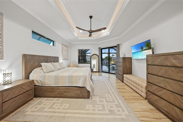 1801 Los Alamos Dr, Punta Gorda, FL 33950 - bedroom featuring a raised ceiling, light wood-type flooring, access to exterior, ornamental molding, and ceiling fan