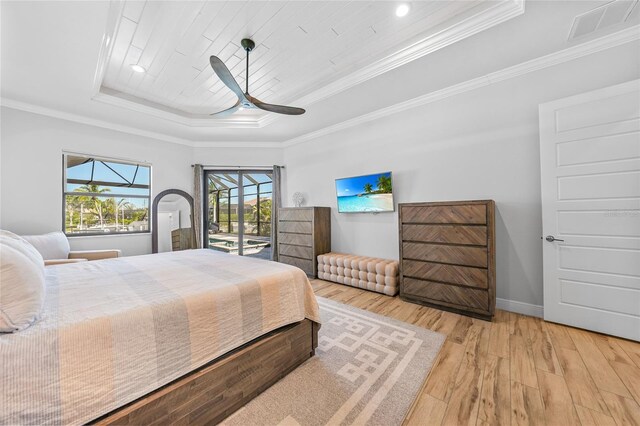 1801 Los Alamos Dr, Punta Gorda, FL 33950 - bedroom with a tray ceiling, wood finished floors, access to exterior, crown molding, and a ceiling fan