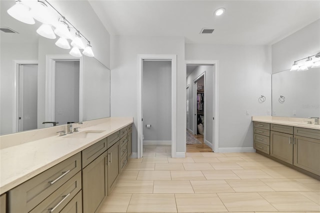 1801 Los Alamos Dr, Punta Gorda, FL 33950 - full bath with two vanities, a spacious closet, and recessed lighting
