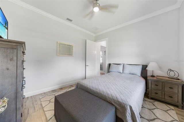 1801 Los Alamos Dr, Punta Gorda, FL 33950 - bedroom featuring light wood-type flooring, crown molding, and a ceiling fan