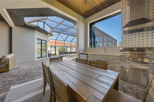 1801 Los Alamos Dr, Punta Gorda, FL 33950 - view of patio with an outdoor kitchen, outdoor dining area, a lanai, and a ceiling fan