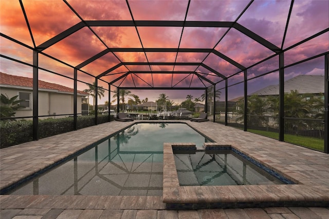 1801 Los Alamos Dr, Punta Gorda, FL 33950 - pool at dusk featuring a patio area and a pool with connected hot tub