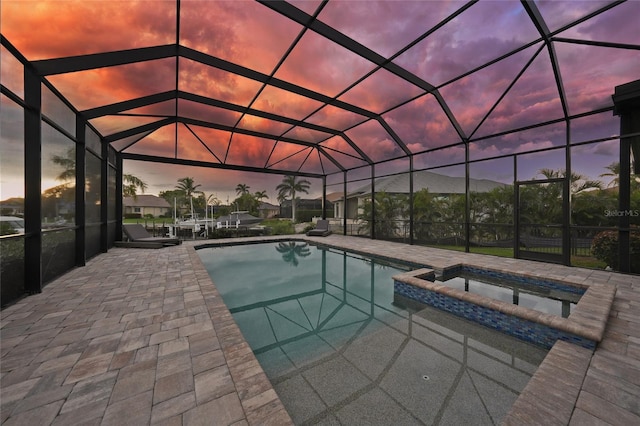 1801 Los Alamos Dr, Punta Gorda, FL 33950 - view of swimming pool featuring a pool with connected hot tub, a lanai, and a patio