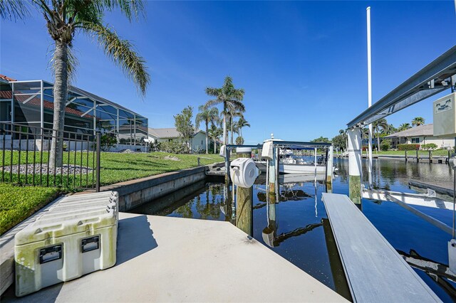 1801 Los Alamos Dr, Punta Gorda, FL 33950 - dock with boat lift, a water view, and a lawn