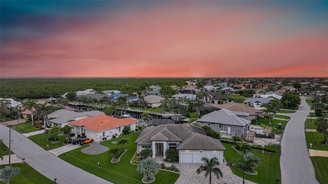 1801 Los Alamos Dr, Punta Gorda, FL 33950 - aerial view at dusk of a residential view
