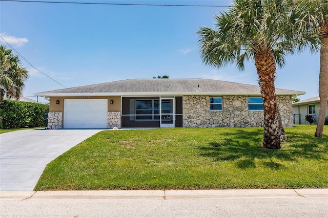 444 Edgewood Rd, Venice, FL 34293 - ranch-style house featuring stone siding, concrete driveway, a garage, and a front yard
