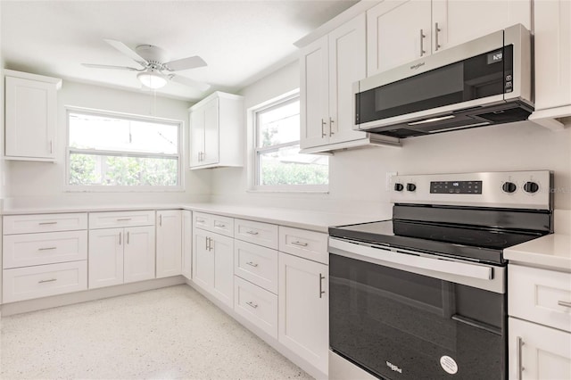 444 Edgewood Rd, Venice, FL 34293 - kitchen featuring appliances with stainless steel finishes, white cabinetry, a ceiling fan, and light countertops