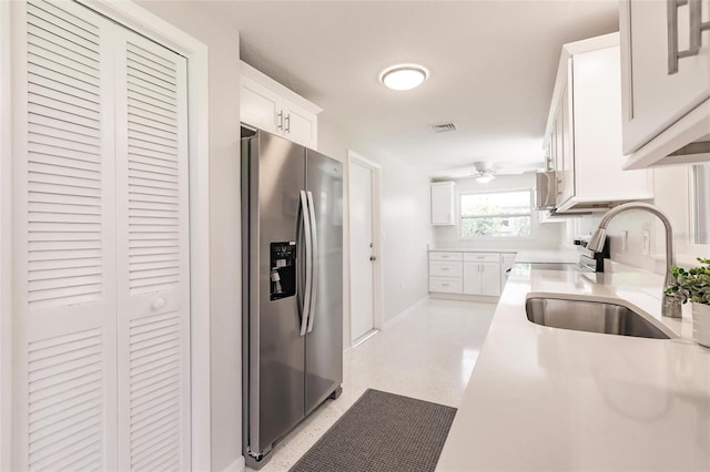 444 Edgewood Rd, Venice, FL 34293 - kitchen featuring stainless steel refrigerator with ice dispenser, white cabinets, light countertops, and ceiling fan