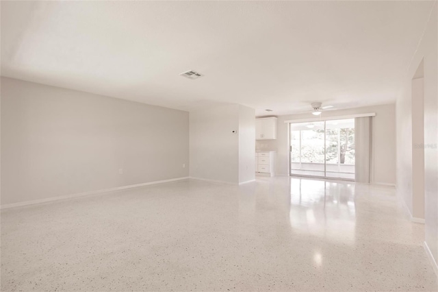 444 Edgewood Rd, Venice, FL 34293 - unfurnished room with dark speckled floor and ceiling fan