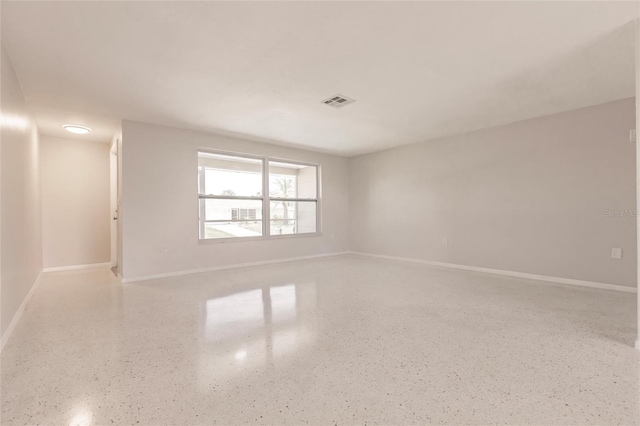 444 Edgewood Rd, Venice, FL 34293 - empty room with speckled floor