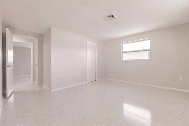 444 Edgewood Rd, Venice, FL 34293 - spare room with dark speckled floor and baseboards