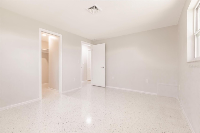 444 Edgewood Rd, Venice, FL 34293 - unfurnished bedroom with speckled floor and a spacious closet