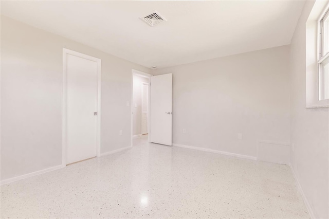 444 Edgewood Rd, Venice, FL 34293 - unfurnished bedroom with speckled floor and baseboards