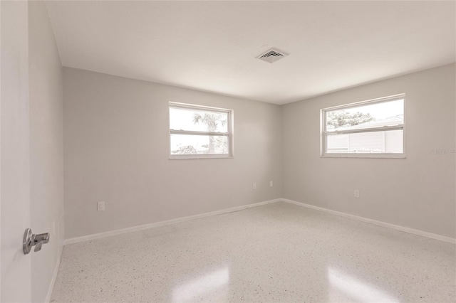 444 Edgewood Rd, Venice, FL 34293 - unfurnished room featuring plenty of natural light and speckle patterned floor