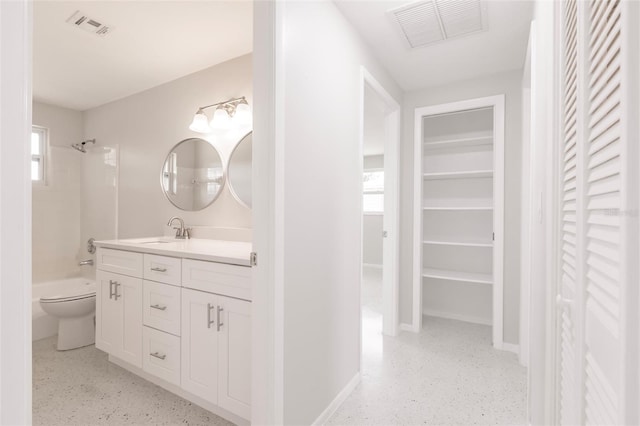 444 Edgewood Rd, Venice, FL 34293 - bathroom featuring a closet, vanity, shower / bath combination, and speckle patterned floor