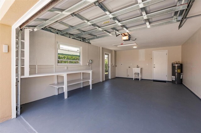 444 Edgewood Rd, Venice, FL 34293 - garage featuring electric water heater and a garage door opener