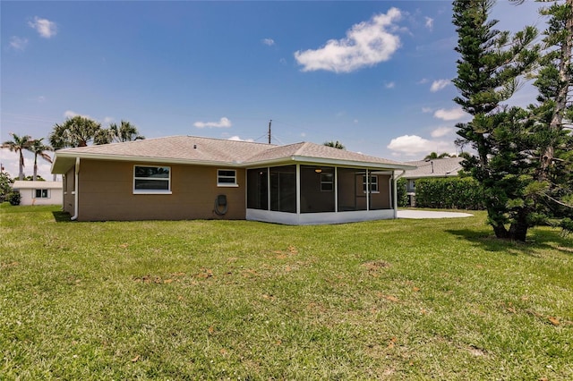 444 Edgewood Rd, Venice, FL 34293 - back of property featuring a sunroom and a lawn