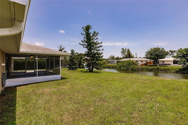 444 Edgewood Rd, Venice, FL 34293 - view of green lawn featuring a water view and a sunroom