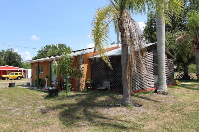 28024 Cleveland Ave, Punta Gorda, FL 33982 - view of front of house with a front yard and stucco siding