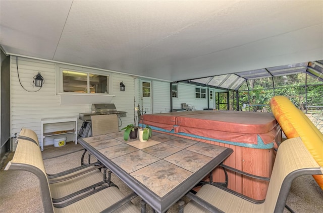 4511 Wilkinson Rd, Sarasota, FL 34233 - view of patio with a hot tub, a lanai, area for grilling, and outdoor dining space