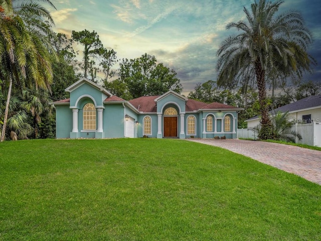 3847 Hopevale St, Fort Myers, FL 33905 - mediterranean / spanish-style home featuring driveway, stucco siding, and an attached garage