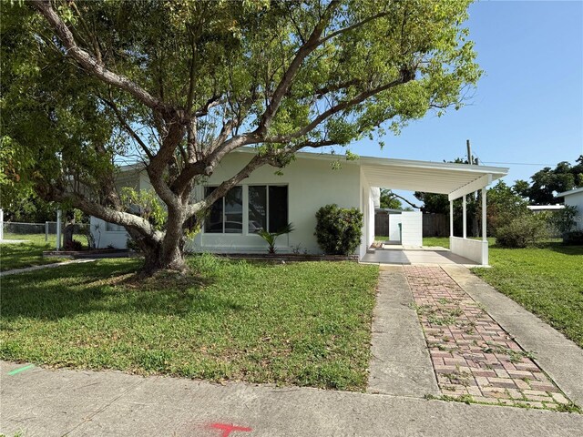 21899 Cellini Ave, Port Charlotte, FL 33952 - view of front of home featuring stucco siding and driveway