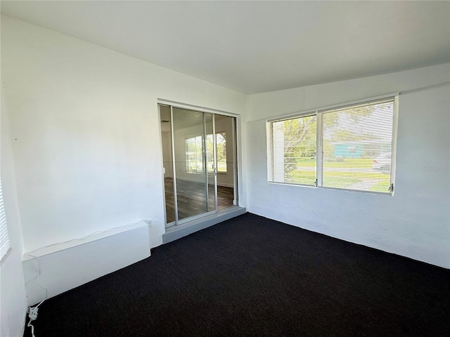 21899 Cellini Ave, Port Charlotte, FL 33952 - unfurnished room featuring dark colored carpet
