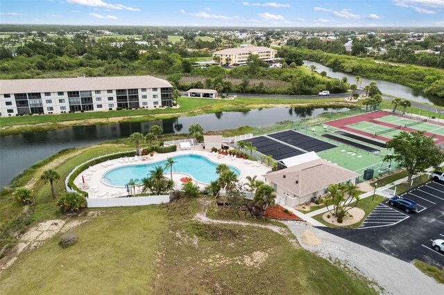 175 Kings Hwy Unit 625, Punta Gorda, FL 33983 - aerial view of a pool, a nearby body of water, and a tree filled landscape