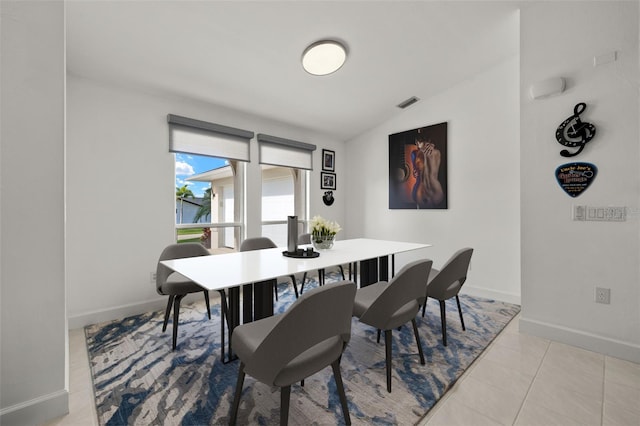 2223 SE 10th Ln, Cape Coral, FL 33990 - dining area with lofted ceiling, baseboards, and tile patterned floors