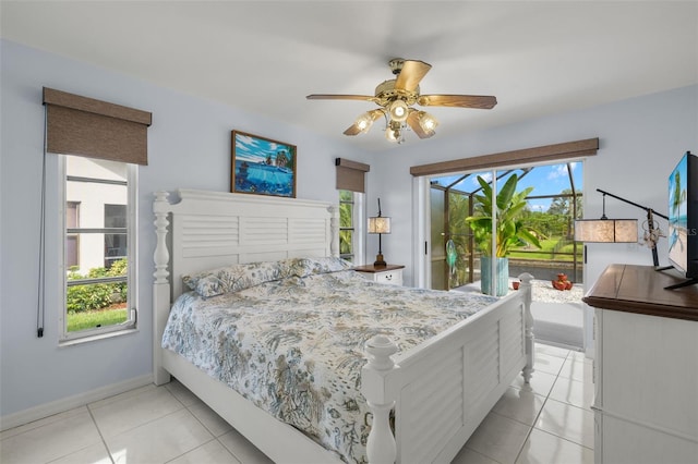 2223 SE 10th Ln, Cape Coral, FL 33990 - bedroom with access to outside, multiple windows, light tile patterned flooring, and baseboards
