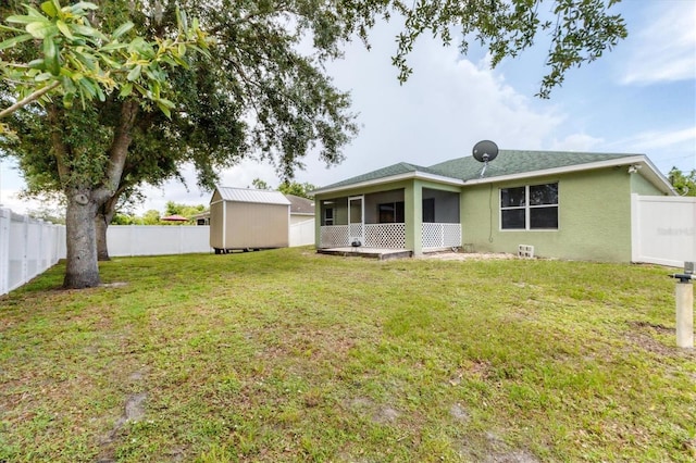 7280 Muncey Rd, North Port, FL 34291 - back of property featuring a fenced backyard, stucco siding, a sunroom, and a storage shed