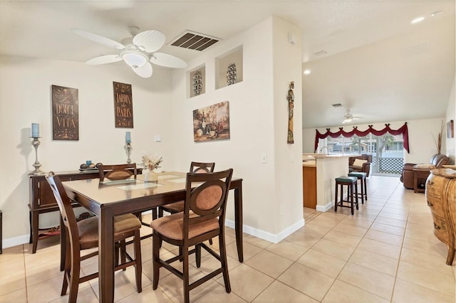 7280 Muncey Rd, North Port, FL 34291 - dining room featuring a ceiling fan, light tile patterned floors, and vaulted ceiling
