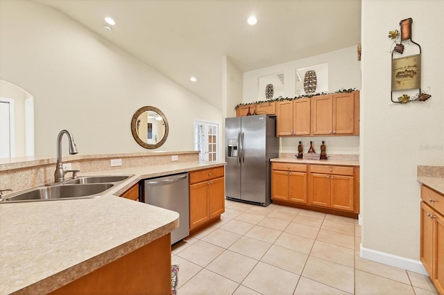 7280 Muncey Rd, North Port, FL 34291 - kitchen featuring appliances with stainless steel finishes, lofted ceiling, recessed lighting, light tile patterned flooring, and light countertops