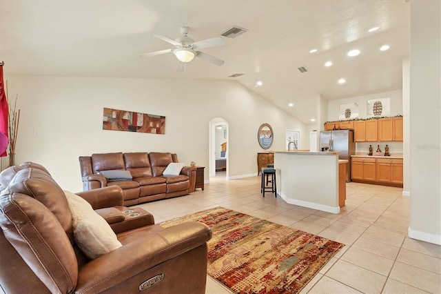 7280 Muncey Rd, North Port, FL 34291 - living room with light tile patterned floors, lofted ceiling, arched walkways, recessed lighting, and ceiling fan