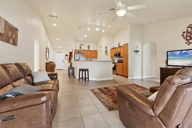 7280 Muncey Rd, North Port, FL 34291 - living area with arched walkways, light tile patterned flooring, recessed lighting, a ceiling fan, and lofted ceiling