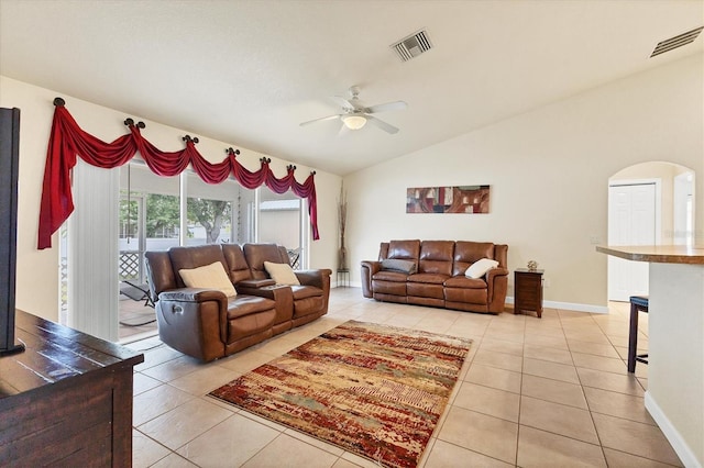 7280 Muncey Rd, North Port, FL 34291 - living area featuring light tile patterned flooring, ceiling fan, vaulted ceiling, and arched walkways