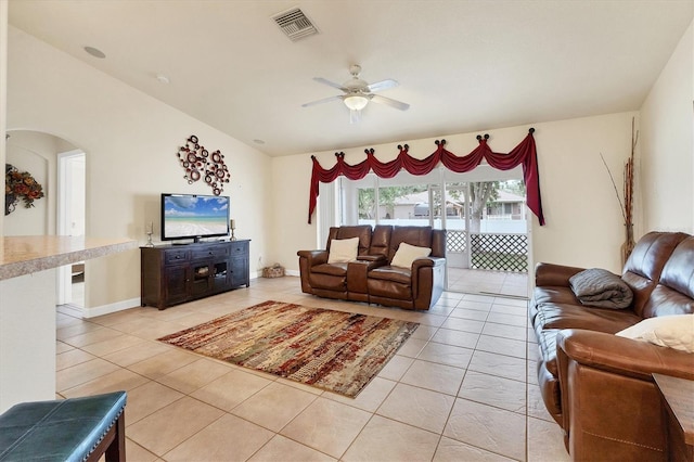 7280 Muncey Rd, North Port, FL 34291 - living area with a ceiling fan, light tile patterned floors, arched walkways, and vaulted ceiling