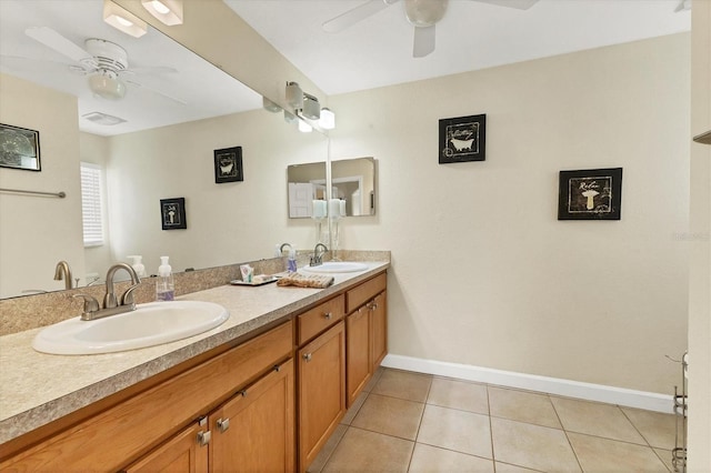 7280 Muncey Rd, North Port, FL 34291 - bathroom featuring ceiling fan, double vanity, and tile patterned flooring