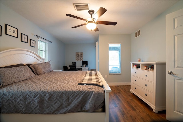 21220 Pemberton Ave, Port Charlotte, FL 33952 - bedroom featuring dark wood finished floors, multiple windows, baseboards, and ceiling fan