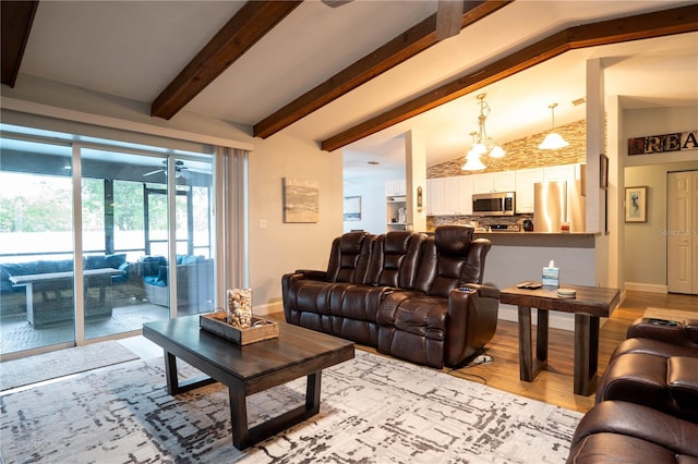 21220 Pemberton Ave, Port Charlotte, FL 33952 - living room featuring wood finished floors, a chandelier, and baseboards