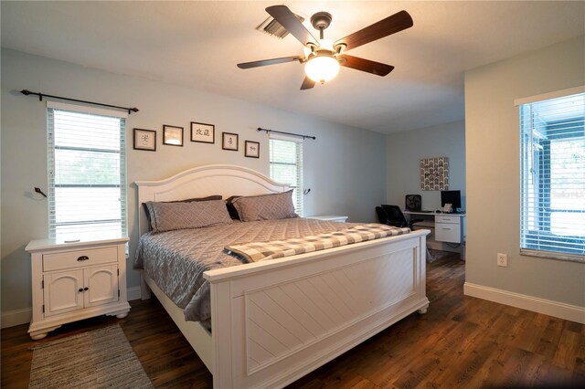 21220 Pemberton Ave, Port Charlotte, FL 33952 - bedroom with dark wood finished floors, baseboards, a ceiling fan, and a desk