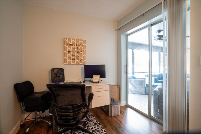 21220 Pemberton Ave, Port Charlotte, FL 33952 - home office featuring dark wood-type flooring and baseboards
