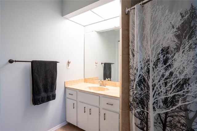 21220 Pemberton Ave, Port Charlotte, FL 33952 - full bathroom featuring vanity, a shower with shower curtain, and baseboards