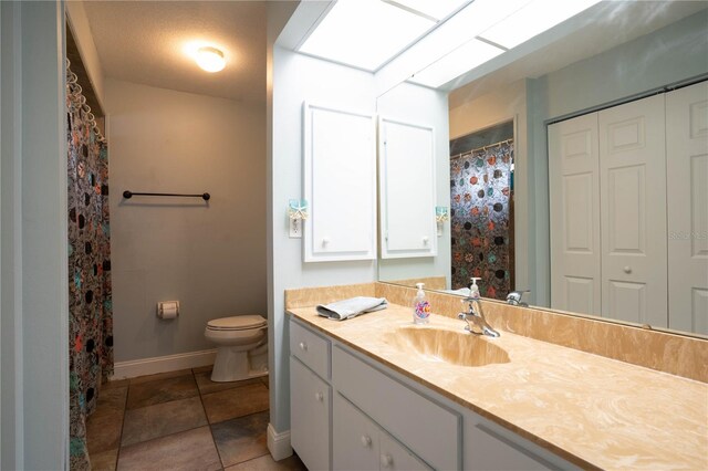 21220 Pemberton Ave, Port Charlotte, FL 33952 - full bathroom featuring vanity, toilet, baseboards, and tile patterned flooring